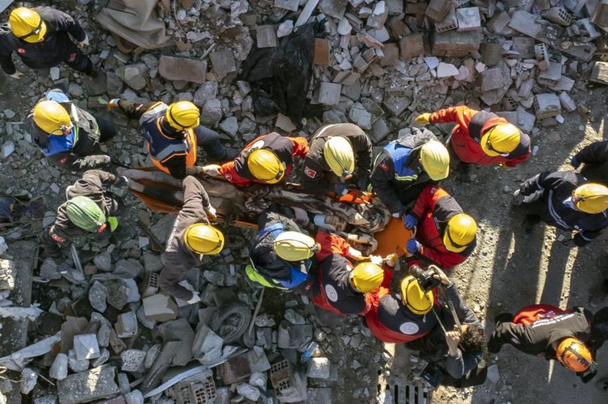 Rescuers carry a survivor who was pulled from under a collapsed building, 60 hours after an earthquake, in Hatay, Türkiye, Feb. 8, 2023. (EPA Photo)