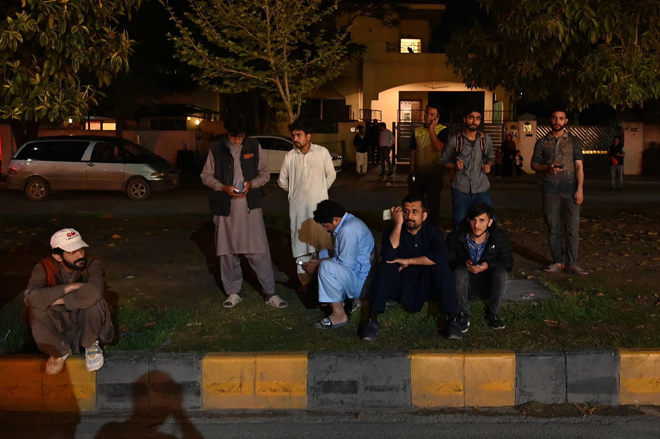 People gather outside a mall following an earthquake in Islamabad, Pakistan, March 21, 2023. (AFP Photo)