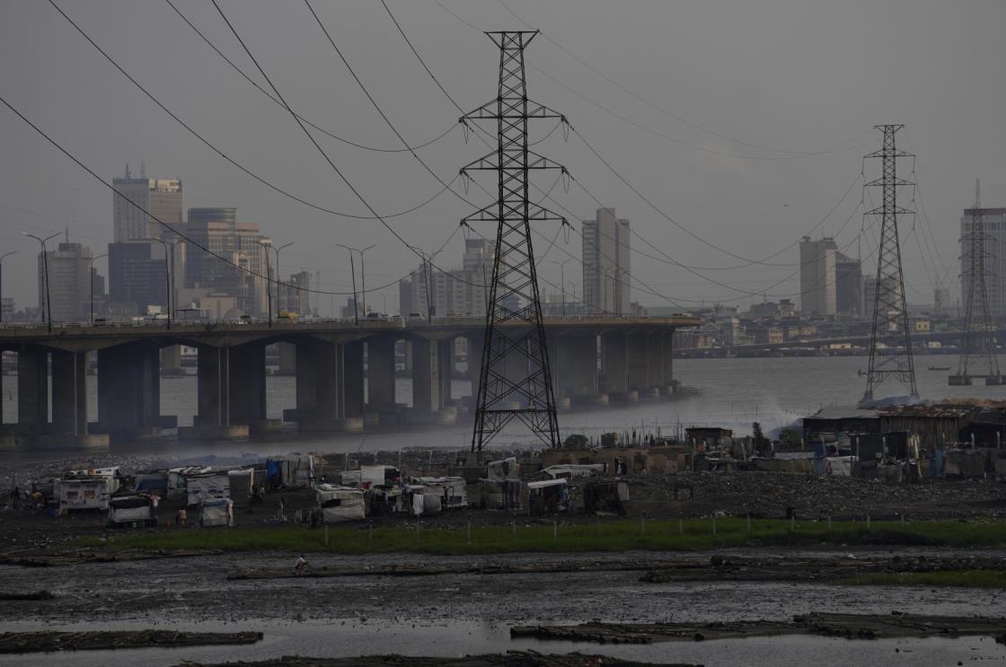 High tension power lines pass through Makoko slum in Lagos, Nigeria, Aug. 20, 2022.  (AP Photo)