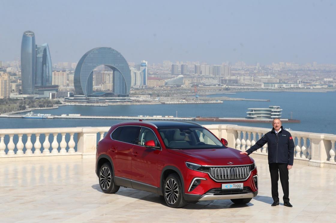 Azerbaijani President Ilham Aliyev poses alo<em></em>ngside his Togg T10X, an SUV model of Türkiye's first domestic car brand, in Baku, Azerbaijan, April 4, 2023. (Photo Courtesy @RTErdogan)