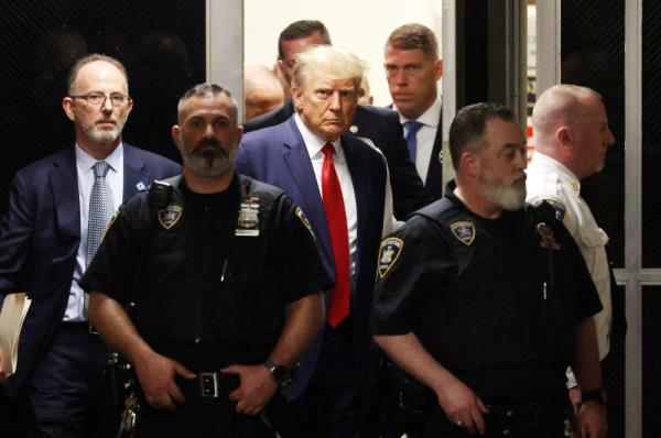 Former U.S. President Do<em></em>nald J. Trump walks toward the courtroom inside New York Criminal Court in New York, U.S., April 4, 2023. (EPA Photo)