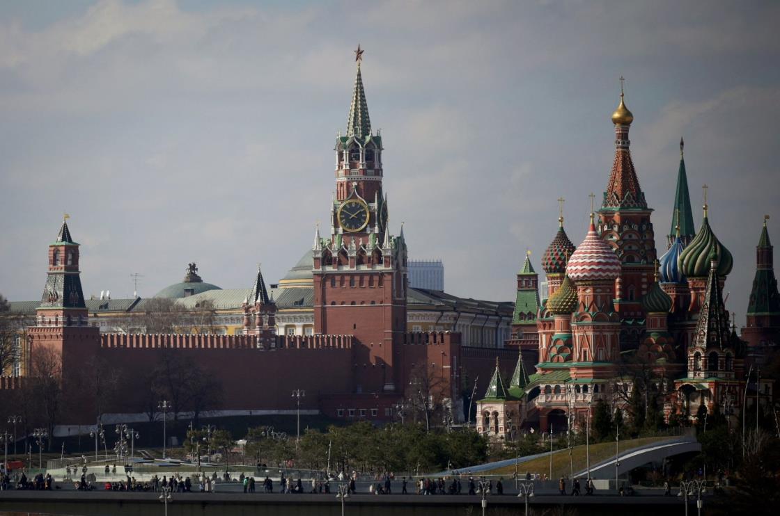 A view of the Kremlin with Spasskaya Tower (C) and St. Basil's Cathedral (R) in downtown Moscow, Russia, April 1, 2023. (AFP Photo by Natalia KOLESNIKOVA / AFP)