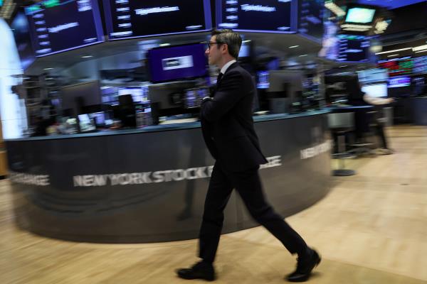 Traders work on the floor of the NYSE in New York