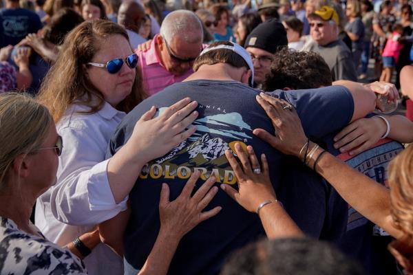 Community members embrace each other during a vigil the day after a shooting during a teenager's birthday party in Dadeville, Alabama, U.S., April 16, 2023. (Reuters Photo)