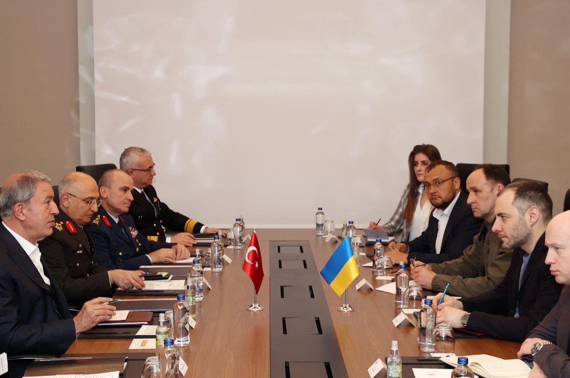 This handout photograph made available on April 18, 2023 by the Turkish Ministry of Natio<em></em>nal Defense, shows Defense Minister Hulusi Akar (L) and Ukrainian Minister of Infrastructure Oleksandr Kubrakov (2nd R) meeting in Kayseri, Türkiye. (Photo by Handout / Defense Ministry via AFP)