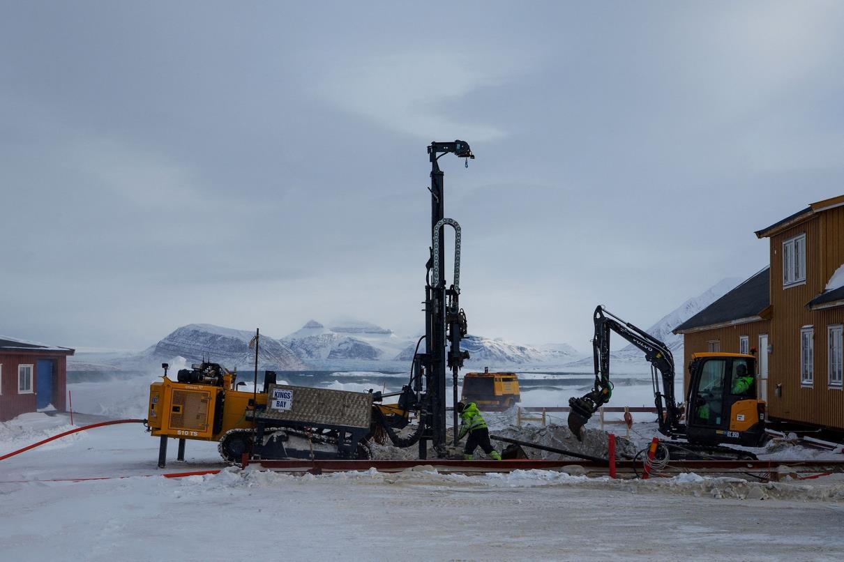 Kings Bay AS co<em></em>ntractors replace the foundation of Butikken building, the town store, after it was damaged by thawing permafrost in Ny-Aalesund, Svalbard, Norway, April 5, 2023. (Reuters Photo)