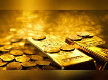 Gold prices steady as dollar retreats; Fed rate path in focus