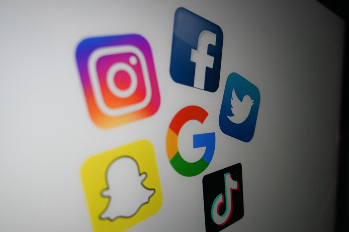 A photo shows the logo of o<em></em>nline giants, Google, Facebook, Twitter, TikTok, Snapchat and Instagram on a computer screen in Lille, France, Oct. 21, 2020. (AFP File Photo)