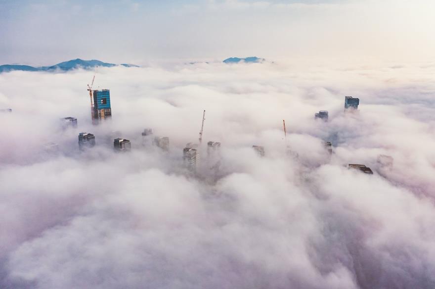 An aerial view shows fog enveloping co<em></em>nstruction sites in Sejong, South Korea. (Getty Images Photo)