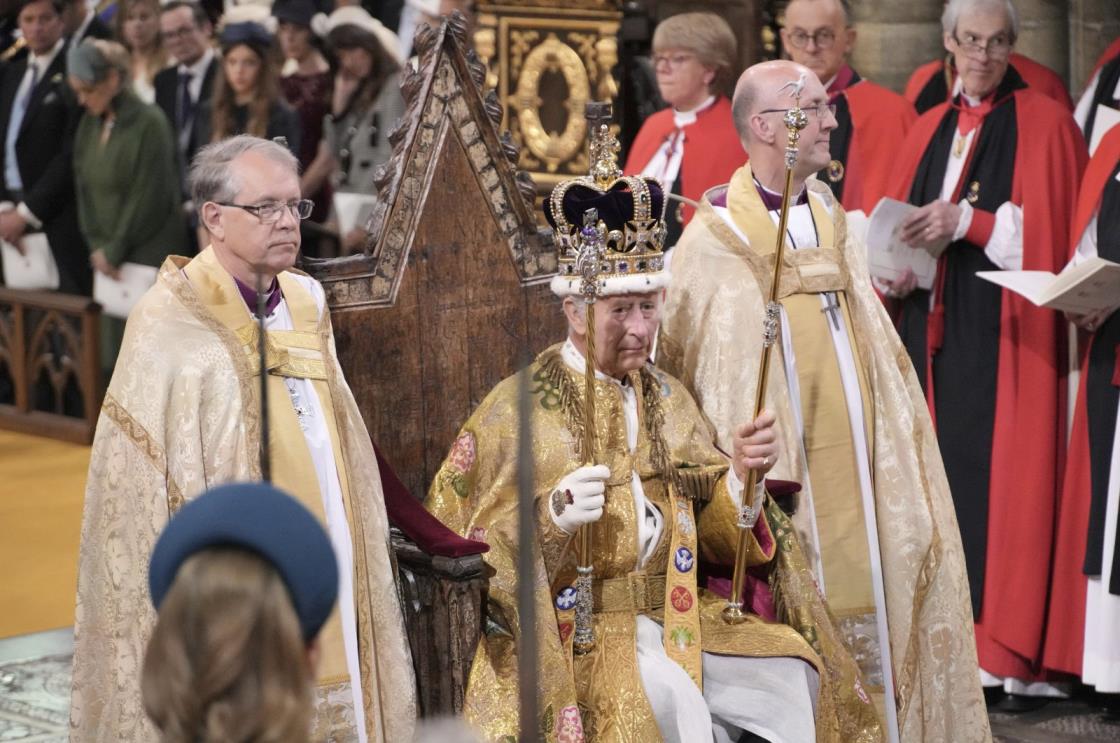 King Charles III sits as he was crowned with Saint Edward's Crown by the Archbishop of Canterbury during the coro<em></em>nation ceremony at Westminster Abbey, London, U.K., May 6, 2023. (AP Photo)